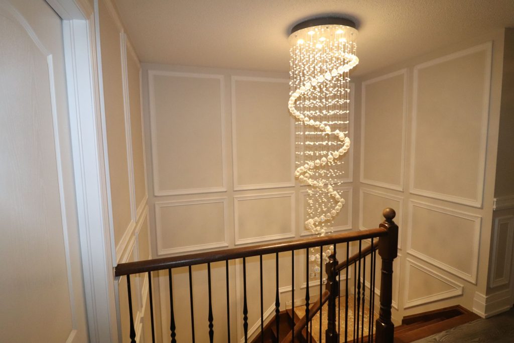 second floor staircase with luxury wainscoting wall decor